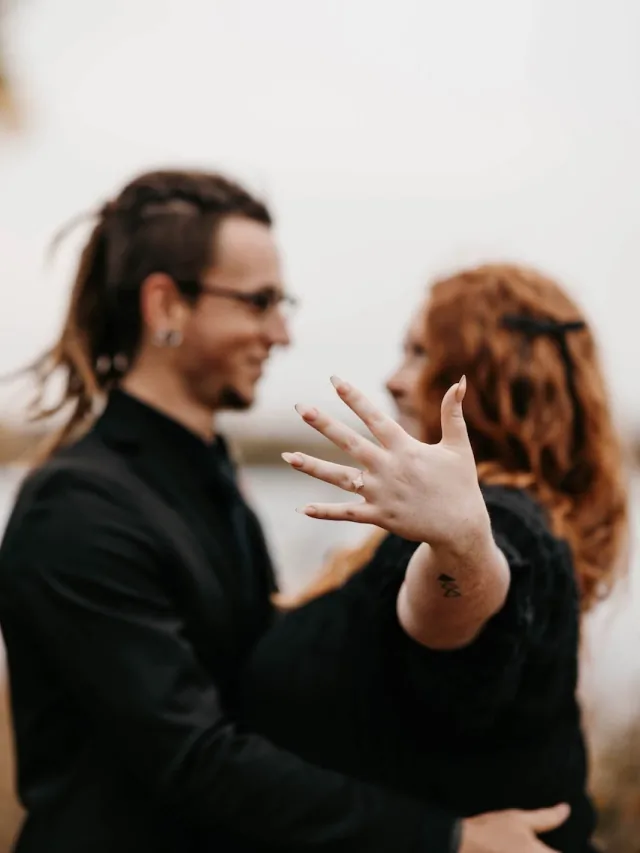 Autumn showing her engagement ring while standing with Grayson